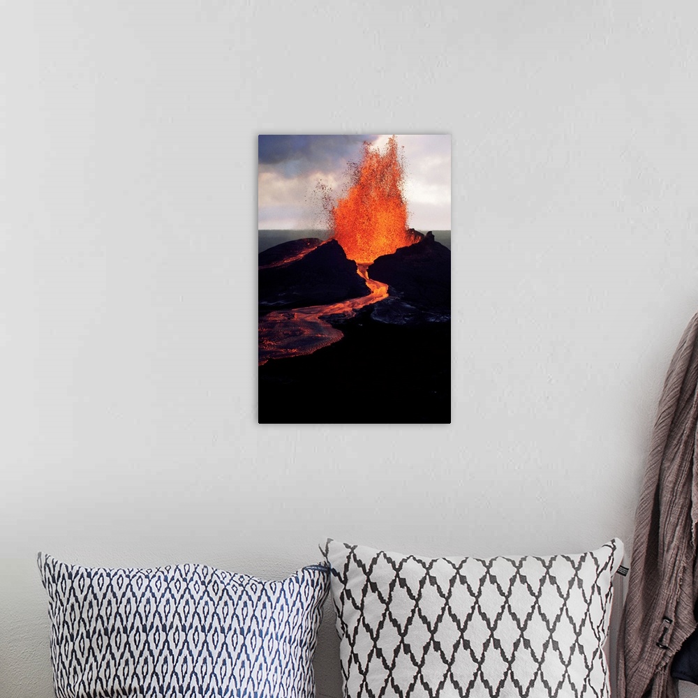 A bohemian room featuring Puu Oo, the easternmost of Kilauea's craters, spews molten lava.
