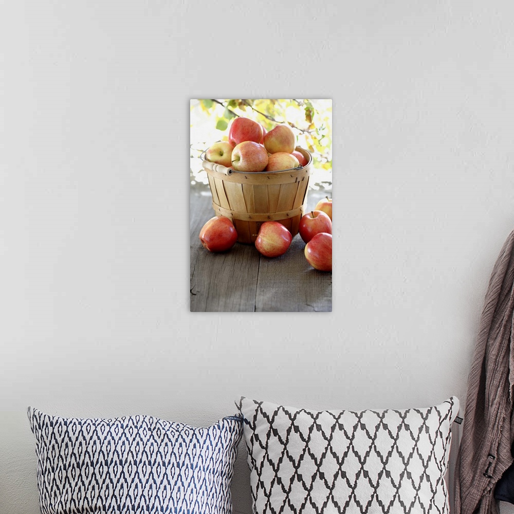 A bohemian room featuring Red apples overflowing basked