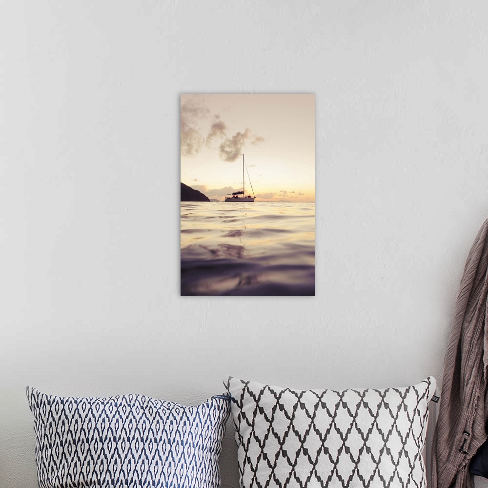 A bohemian room featuring Sailing boat against sunset