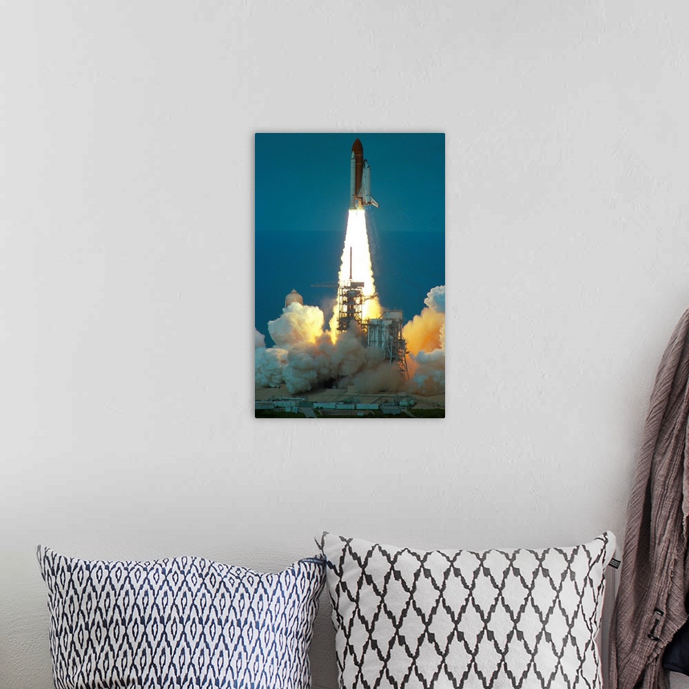 A bohemian room featuring Space Shuttle Challenger Lifting Off