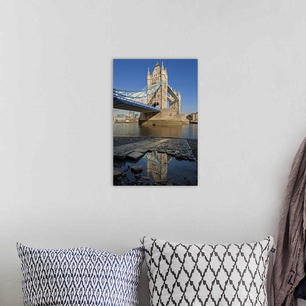 A bohemian room featuring Tower Bridge, the River Thames and the Tower of London reflected in a pool, London.