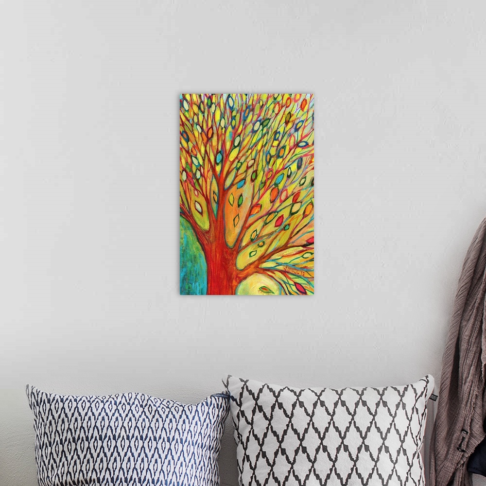 A bohemian room featuring A bright mixture of colors is used to paint tiny leaves on a massive tree that is half shown.