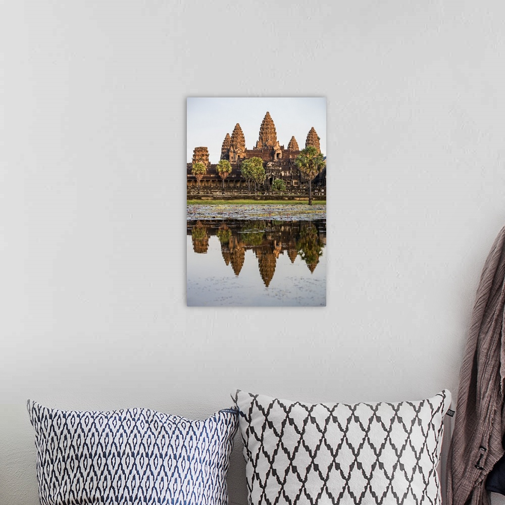 A bohemian room featuring Cambodia, Angkor Wat, Siem Reap Province. The magnificent Khmer temple of Angkor Wat bathed in la...