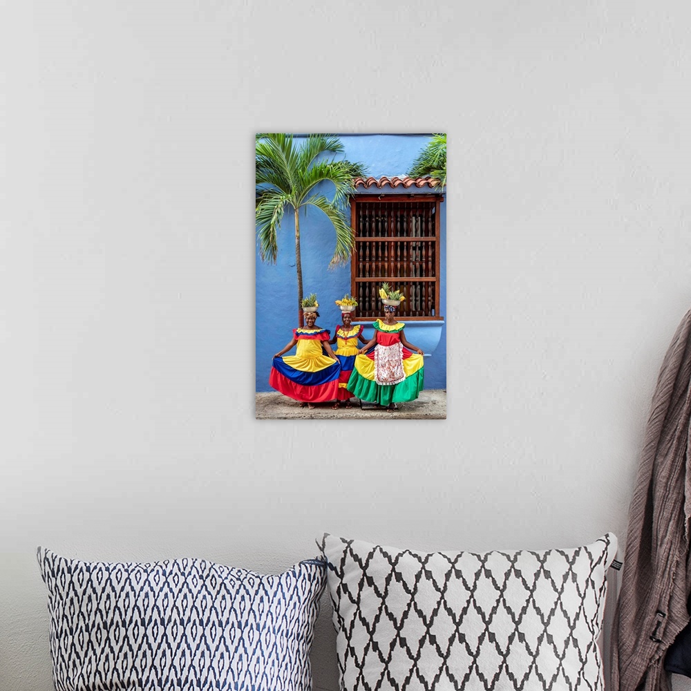 A bohemian room featuring Colourful Palenqueras selling fruits on the street of Cartagena, Bolivar Department, Colombia (MR).