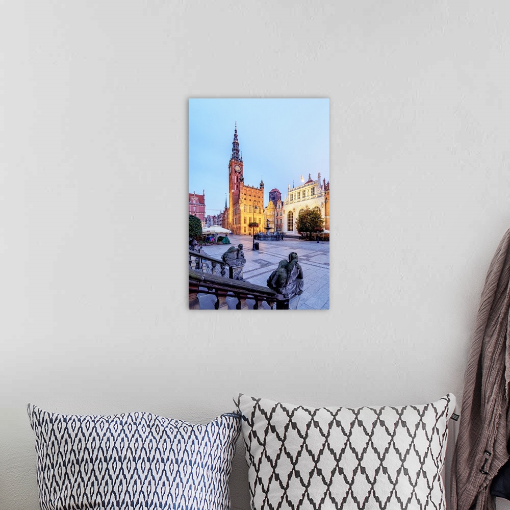 A bohemian room featuring Poland, Pomeranian Voivodeship, Gdansk, Old Town, Twilight view of Long Market and City Hall.
