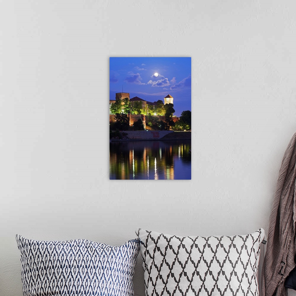 A bohemian room featuring Europe, Poland, Malopolska, Krakow, full moon over Wawel Hill Castle and Cathedral, Vistula River...