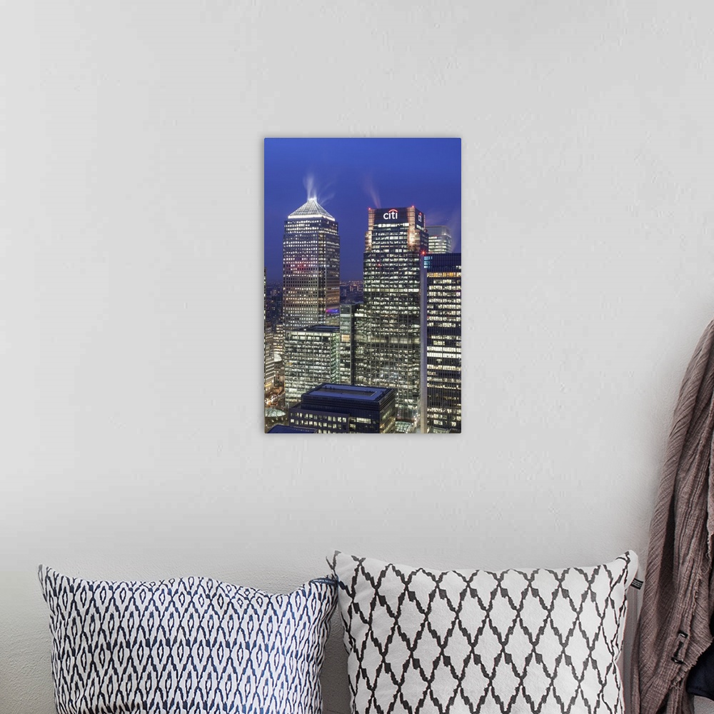 A bohemian room featuring The new London financial district in the docklands at dusk.