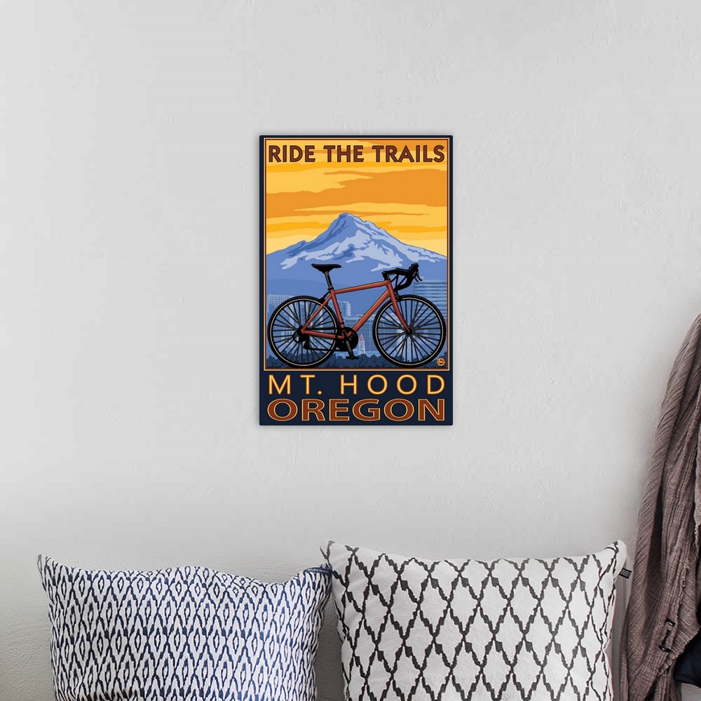 A bohemian room featuring Retro stylized art poster of a mountain bike, with a city skyline and mountain in the background.