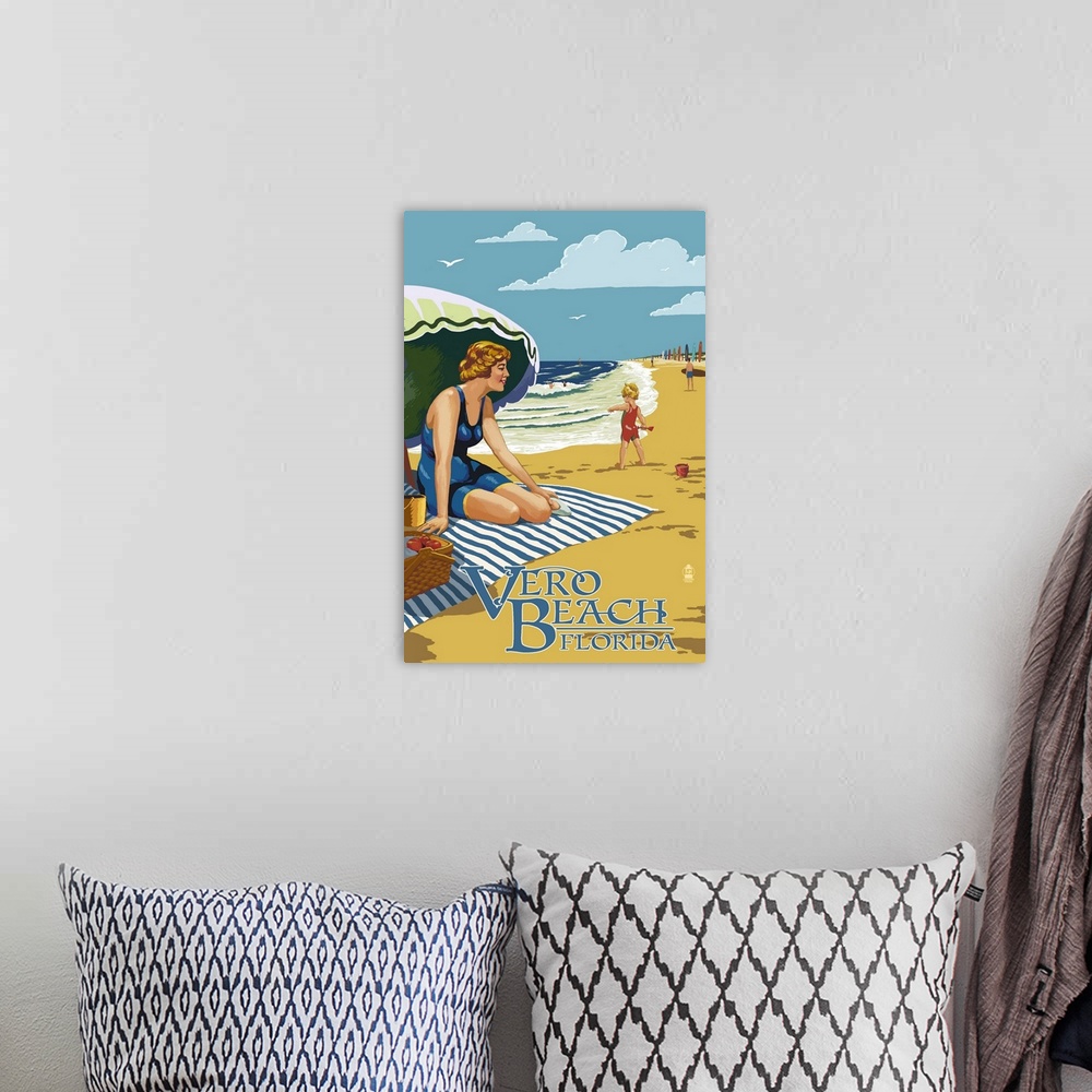 A bohemian room featuring Stylized art poster showing a blonde lady in swimwear sitting on a towel beneath an umbrella watc...