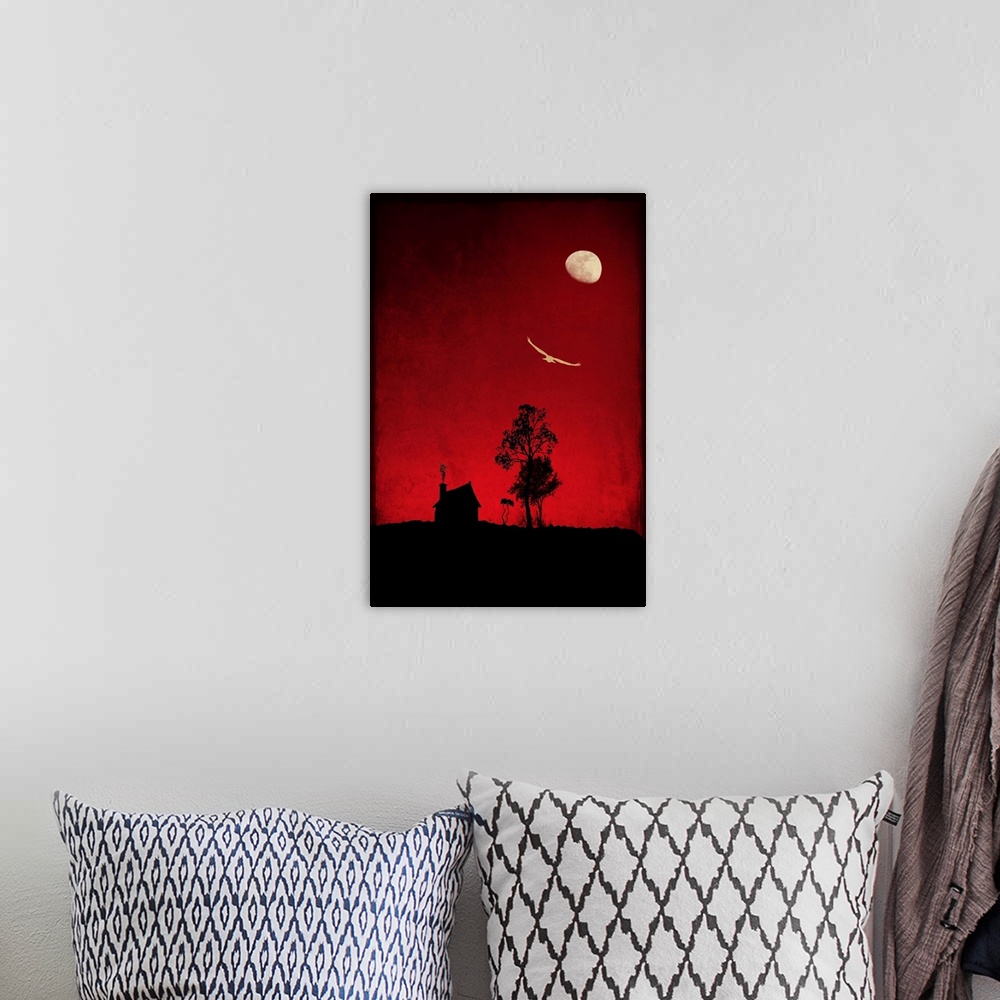 A bohemian room featuring Red sky on a full moon night with a hut and a bird