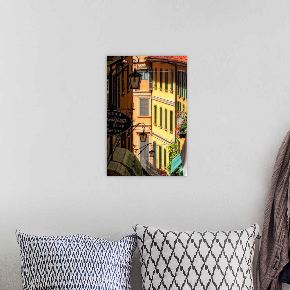 A bohemian room featuring Fine art photo of buildings in an alleyway in an Italian city.