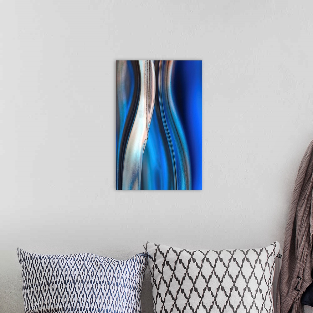 A bohemian room featuring Contemporary abstract photograph of curved linear lines in shades of blue.