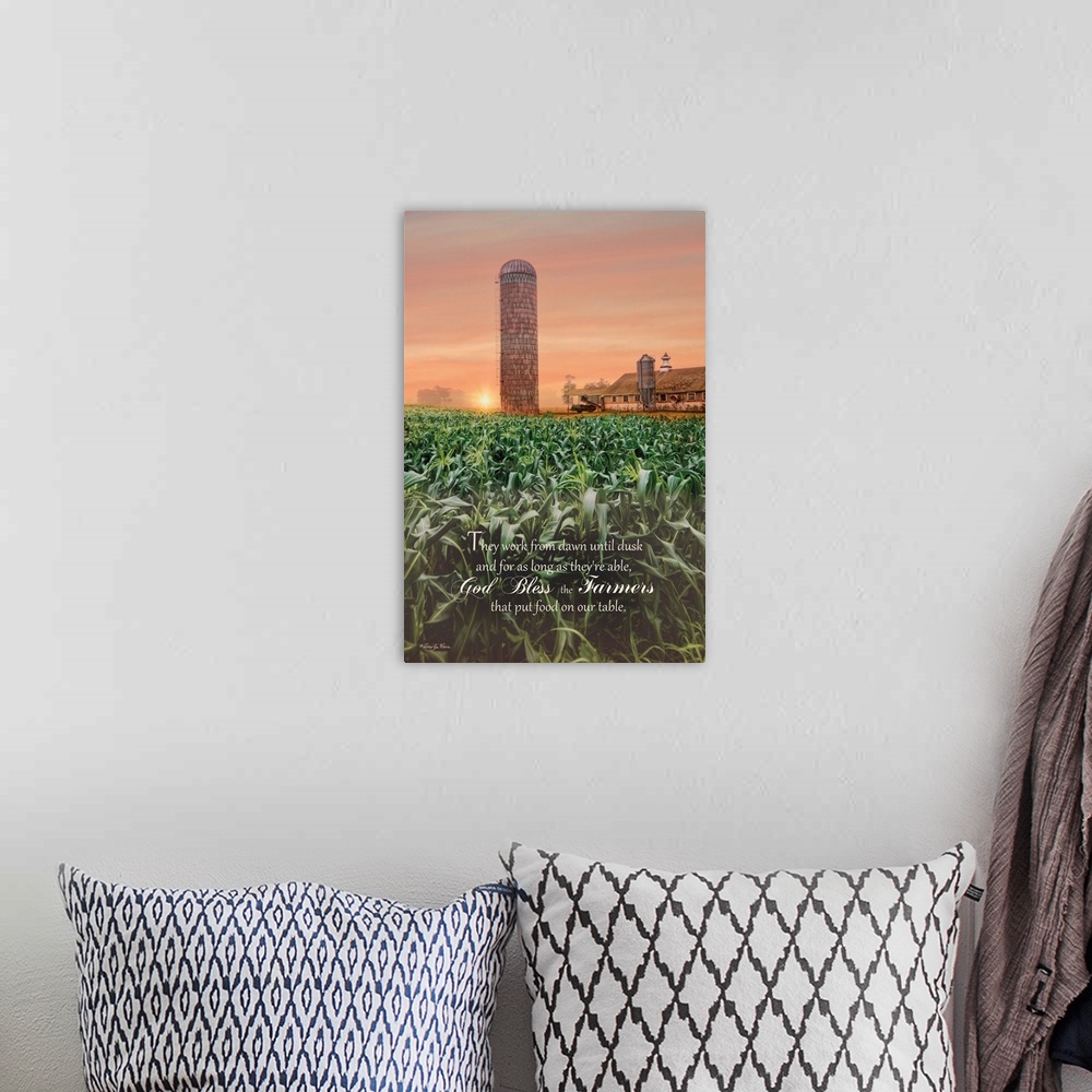 A bohemian room featuring A prayer for farmers over an image of green fields near a silo and farmhouse at sunset.