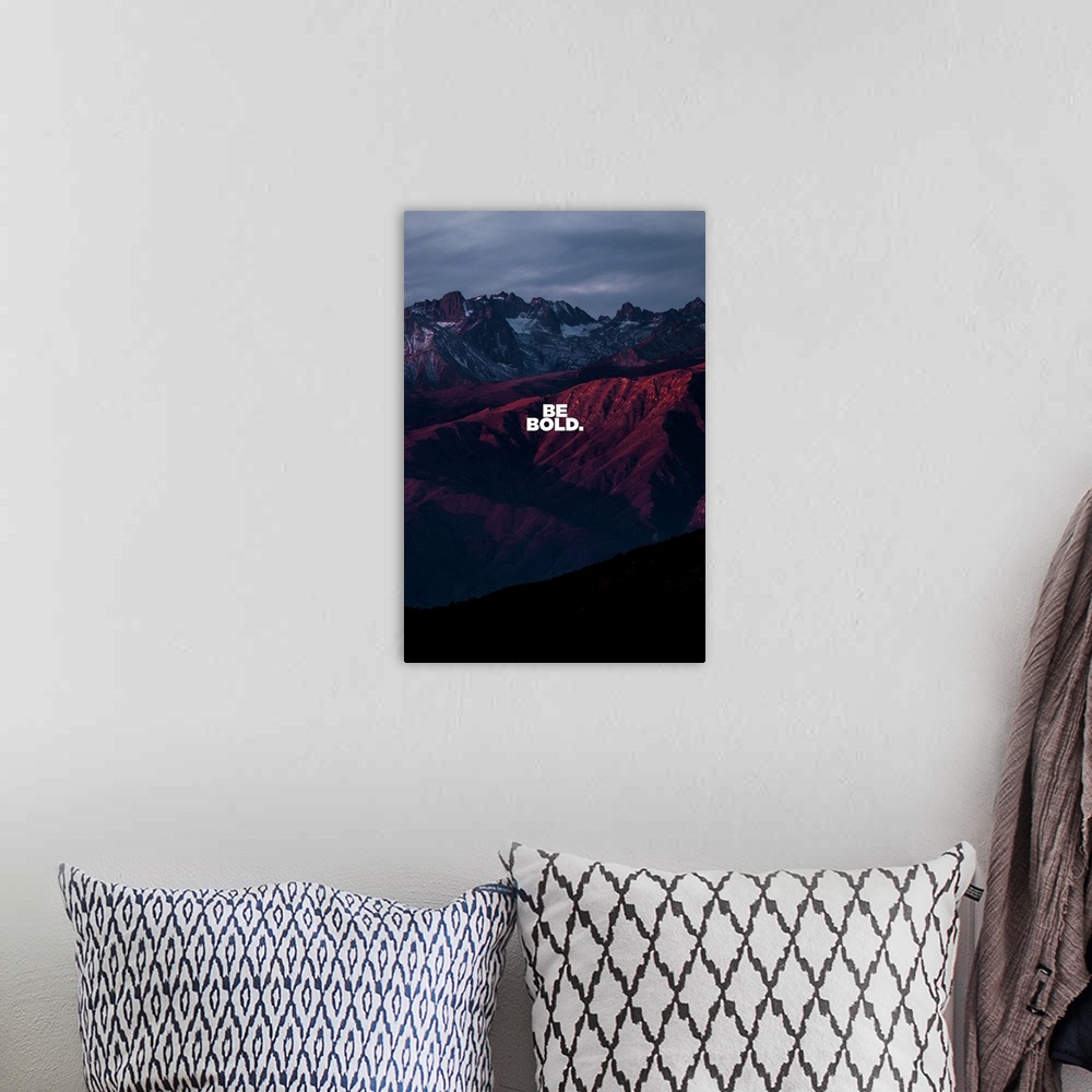 A bohemian room featuring Motivational sentiment over a dramatic sunset mountain view.