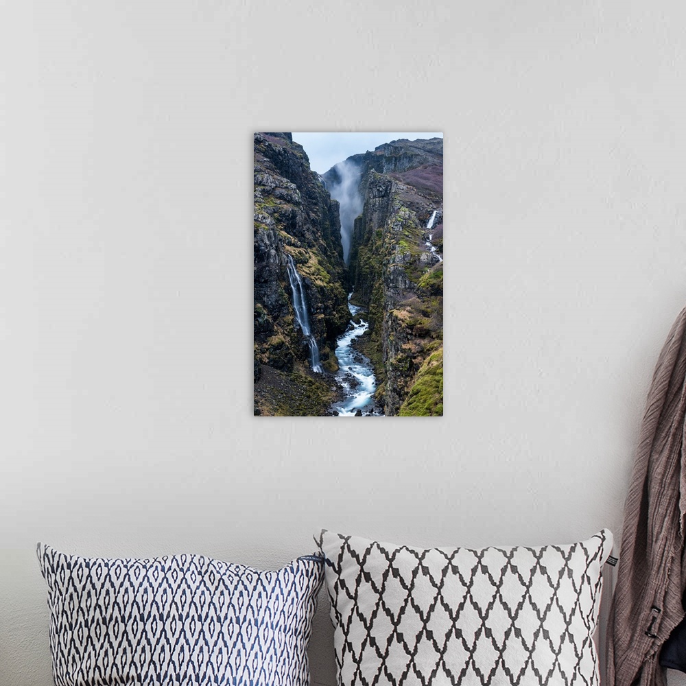 A bohemian room featuring Glymur Waterfall, Iceland