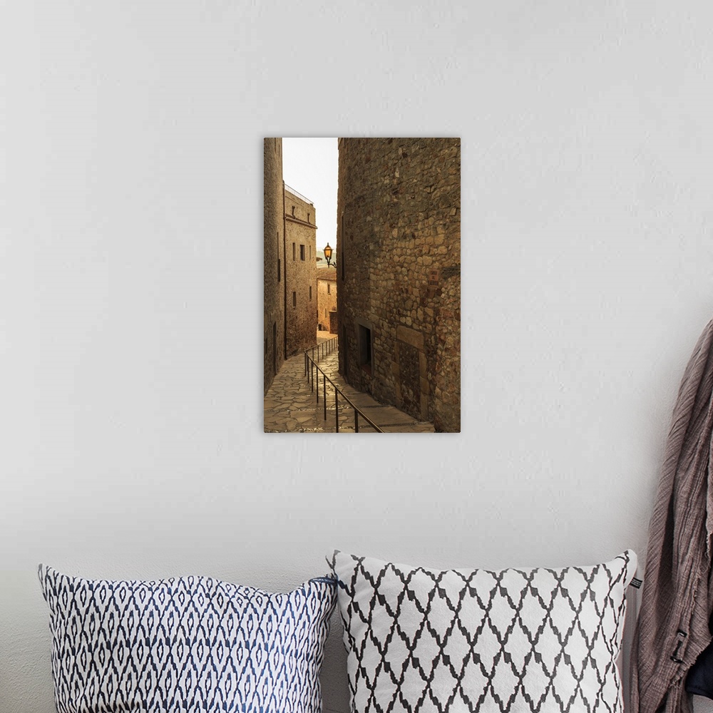 A bohemian room featuring Steep and narrow winding street in gorgeous medieval hilltop walled village, Pals, Baix Emporda, ...