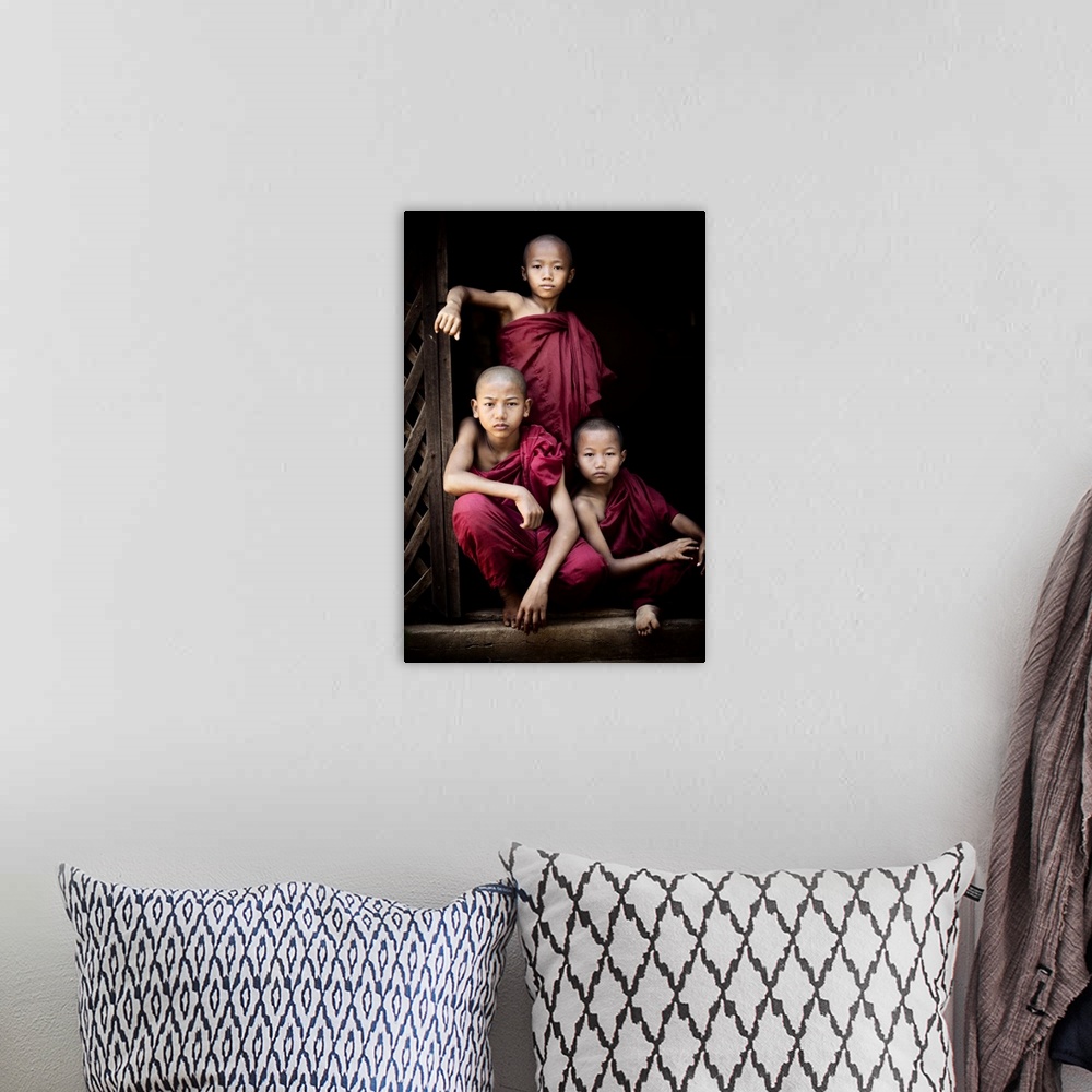 A bohemian room featuring Portrait of three young monks in their monastery, Bagan, Burma