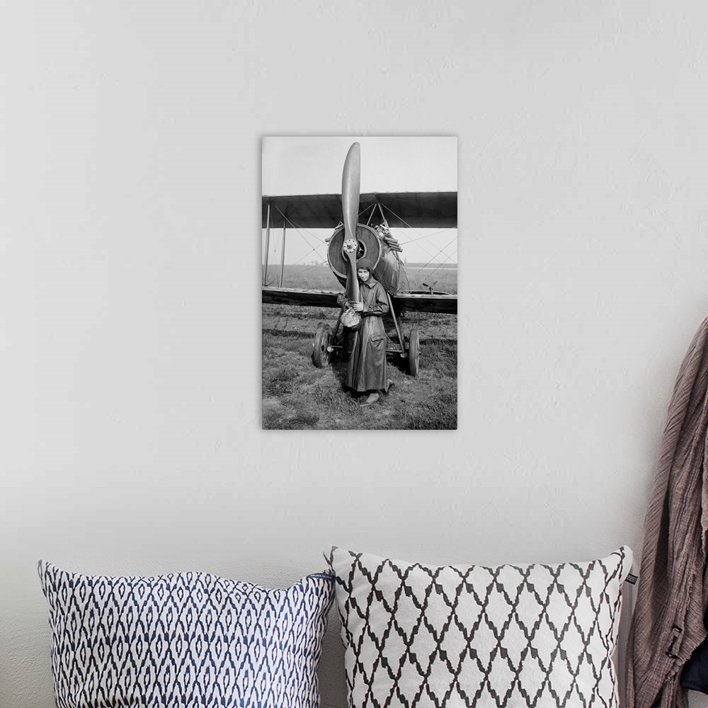 A bohemian room featuring American aviator Katherine Stinson in front of her biplane.