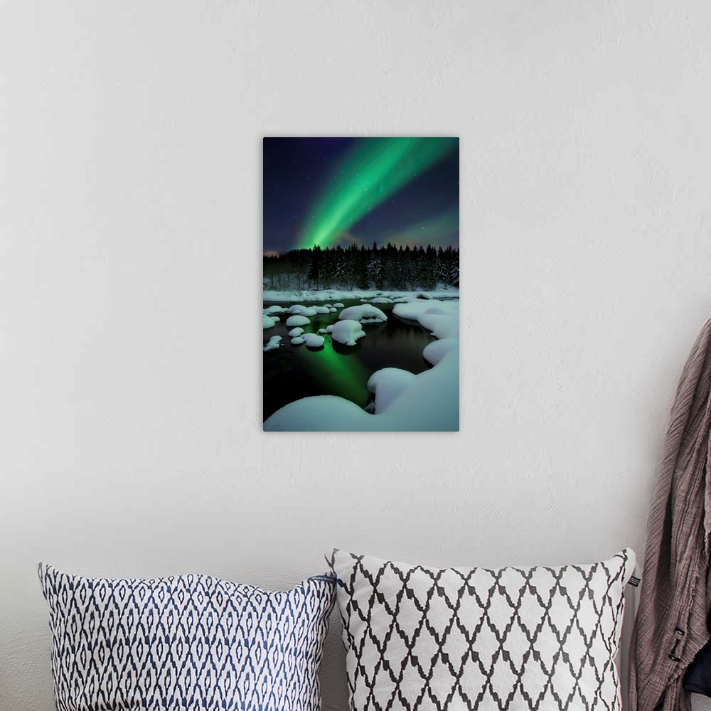 A bohemian room featuring Aurora Borealis over Tennevik River in Troms County, Norway. Auroras are the result of the emissi...