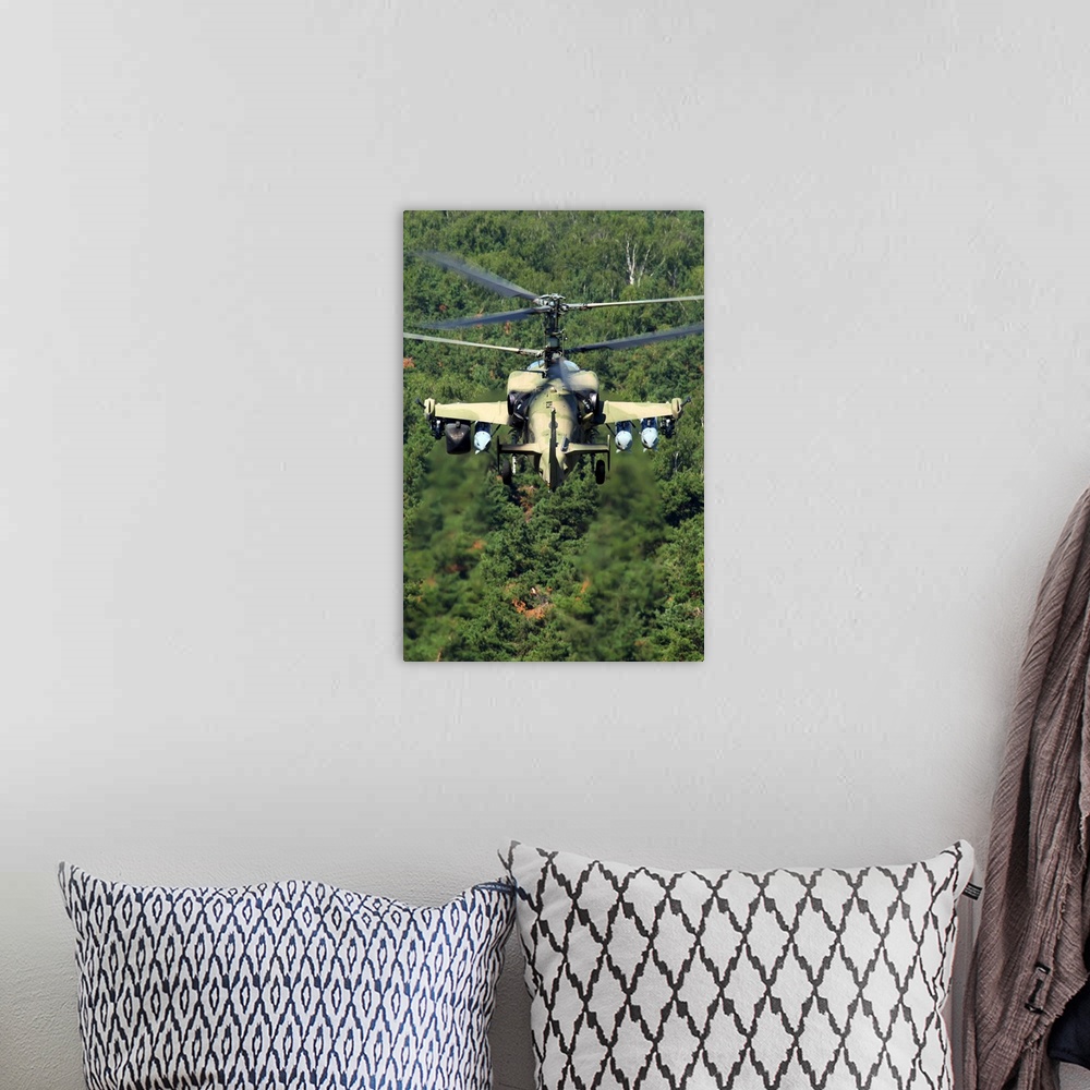 A bohemian room featuring Ka-52 Alligator attack helicopter of the Russian Air Force flying over treetops.