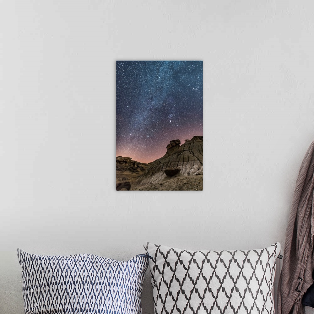 A bohemian room featuring Orion and the winter stars over the badlands of Dinosaur Provincial Park, Canada.