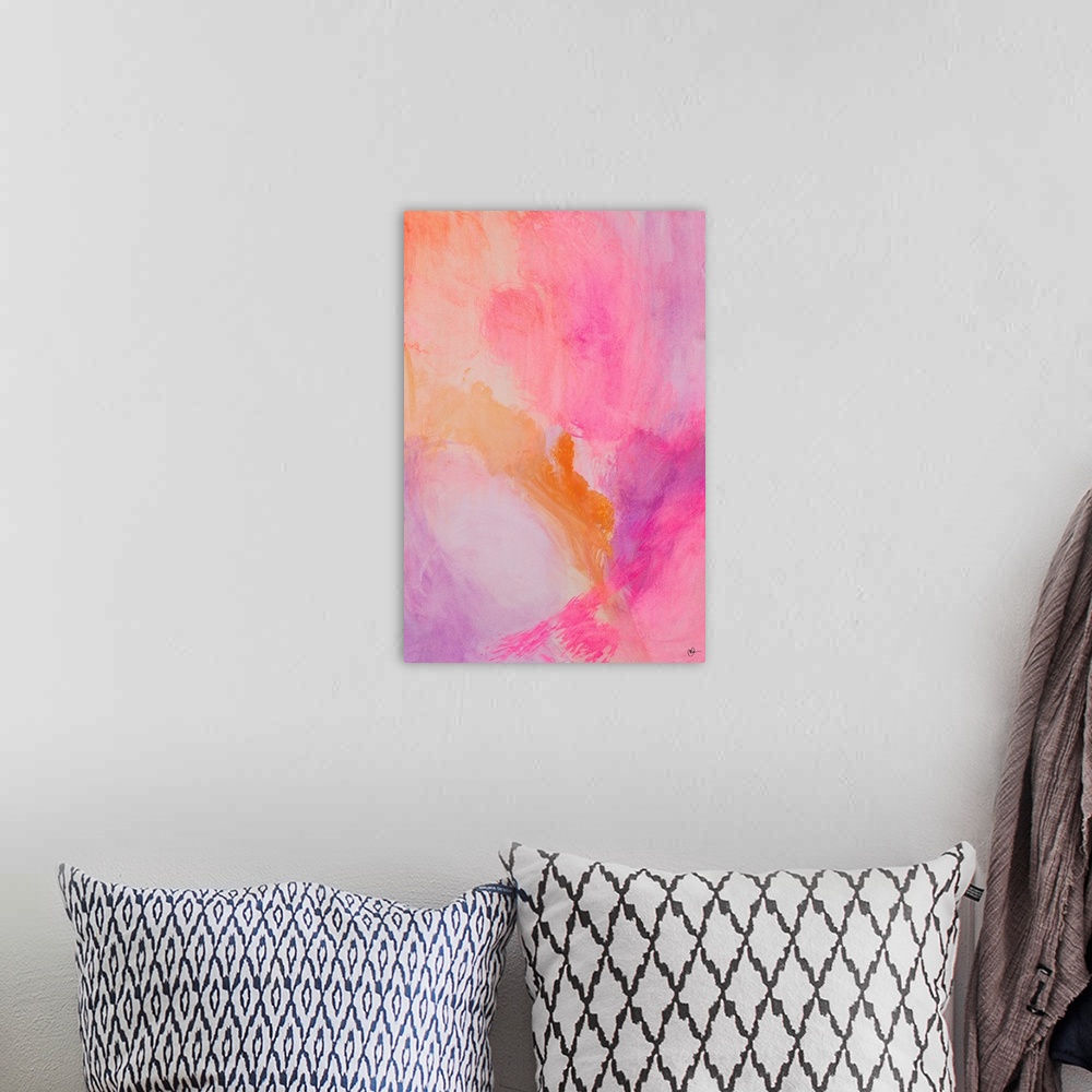 A bohemian room featuring A contemporary abstract watercolor painting with warm pink, purple, and orange hues.