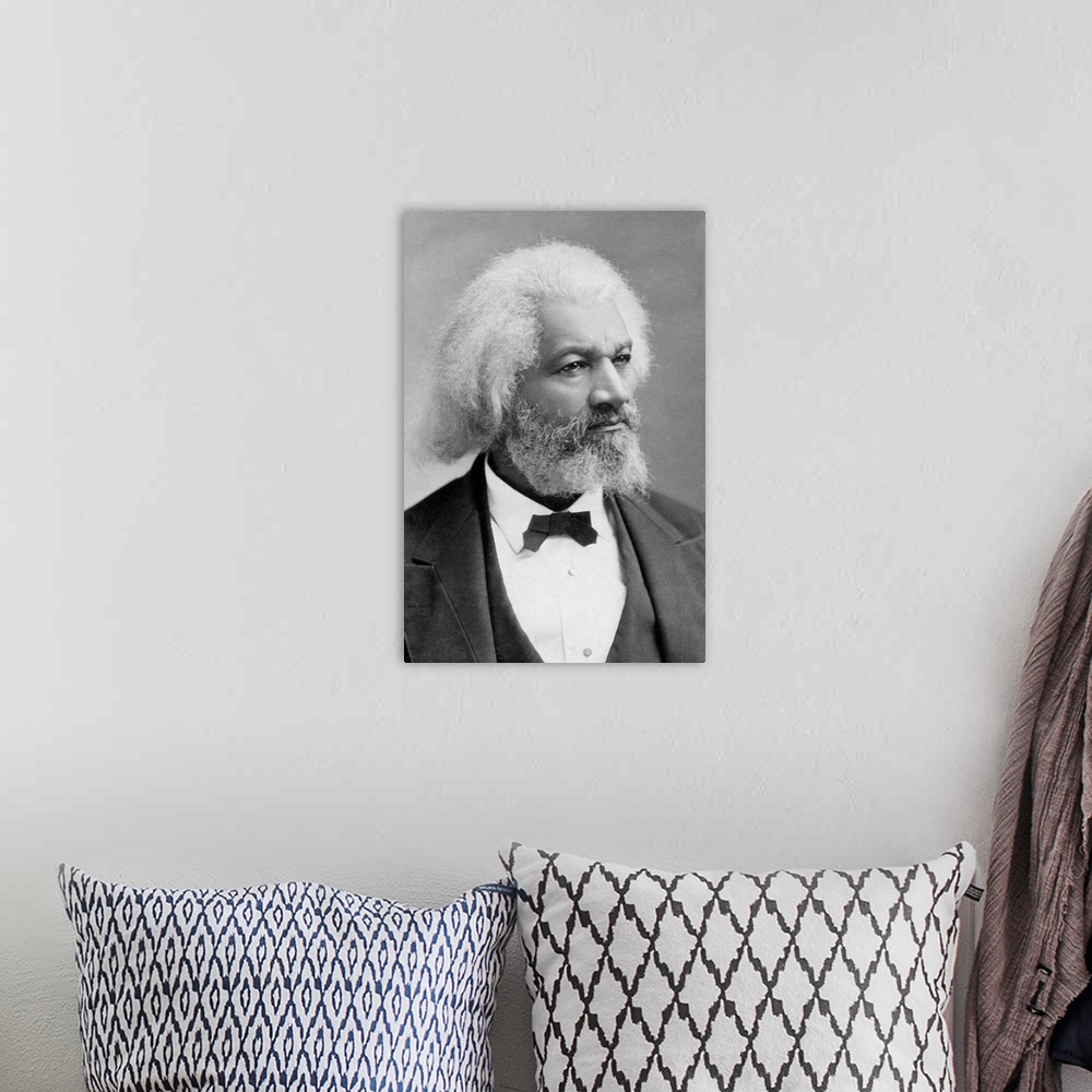 A bohemian room featuring FREDERICK DOUGLASS (c1817-1895). American abolitionist and writer. Photograph, c1880.
