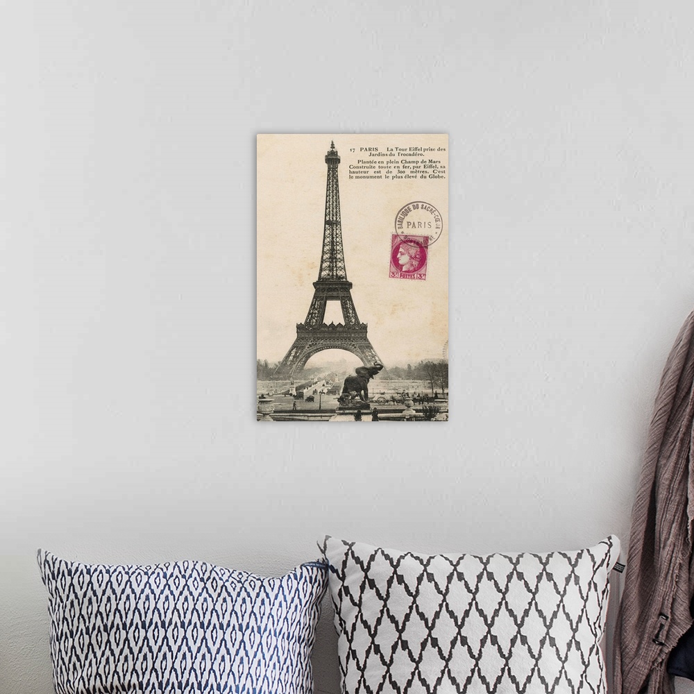 A bohemian room featuring Vintage photograph of the Eiffel Tower with text to the right of the image and a red stamp near t...