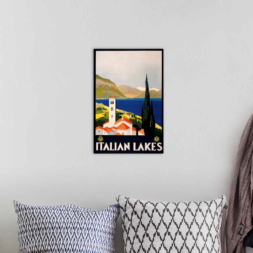 A bohemian room featuring Vintage travel advertising poster for the Italian lake area in Europe.