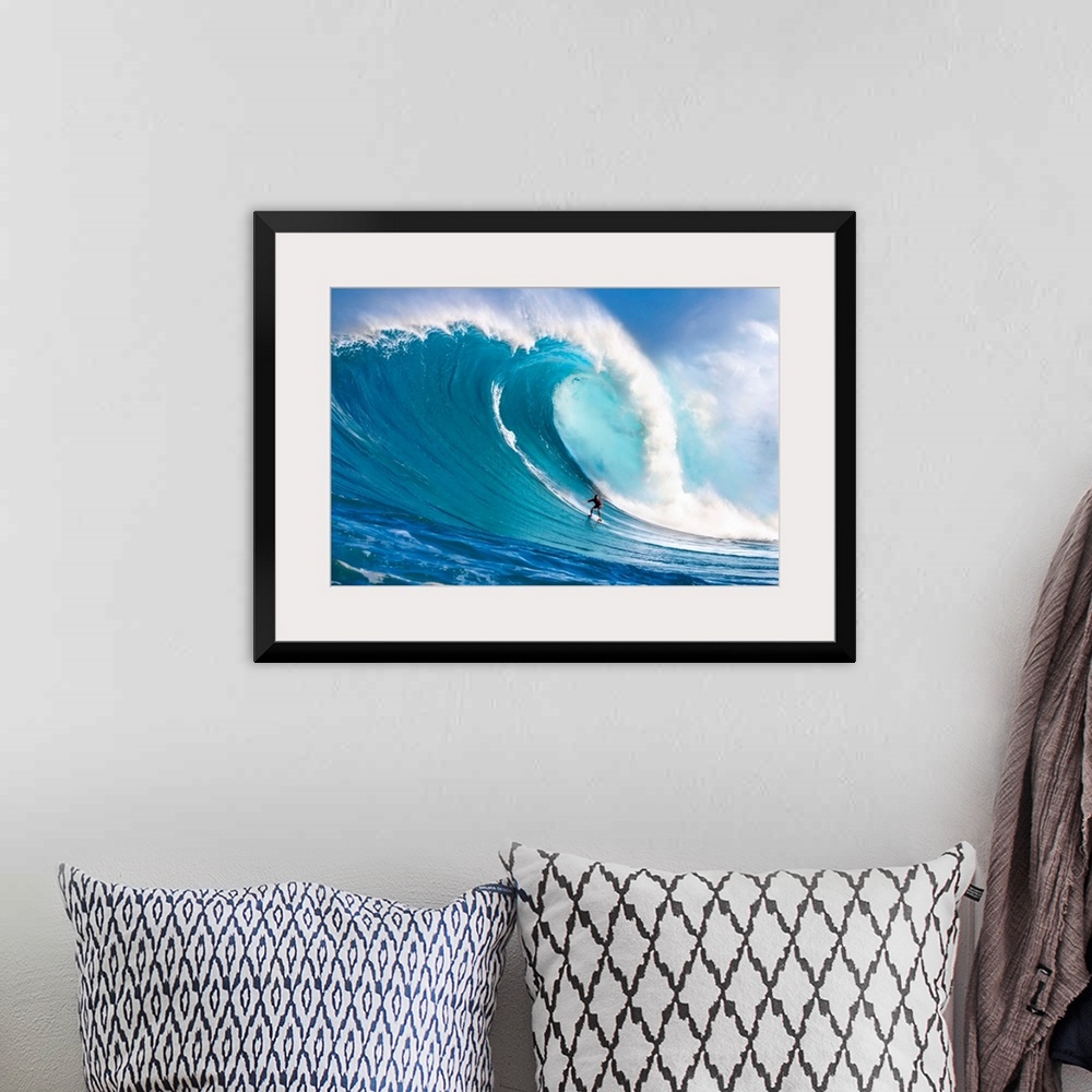 A bohemian room featuring A tow-in surfer drops down the face of Hawaii's big surf at Peahi (Jaws) off North shore Maui; Ma...