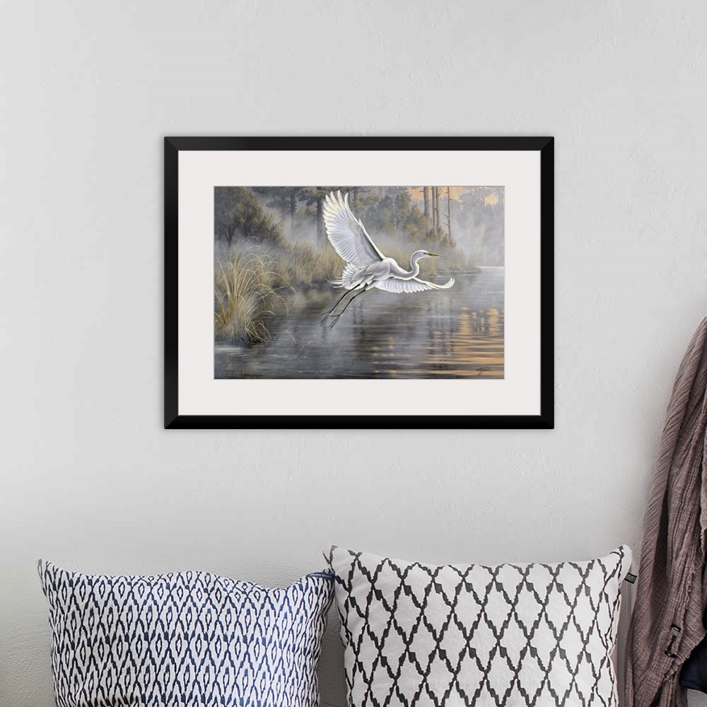 A bohemian room featuring Great white egret flying over a pond at sunrise.