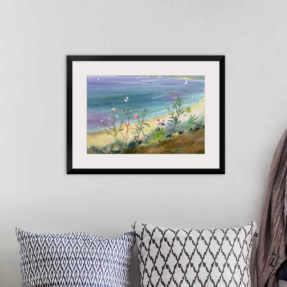 A bohemian room featuring A landscape painting of wildflowers growing along the Grecian shore of a pastel colored sea.