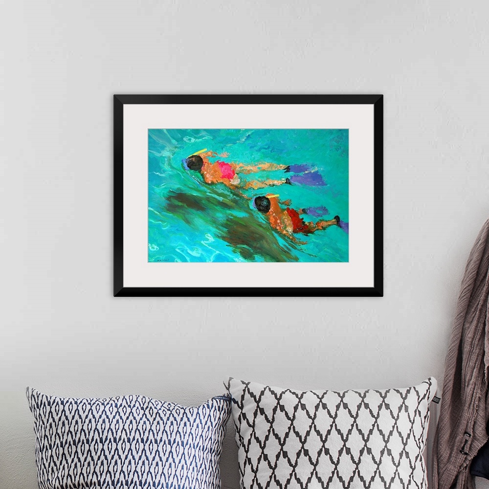 A bohemian room featuring Huge contemporary art shows a man and woman snorkeling through clear water.  As the two people tr...