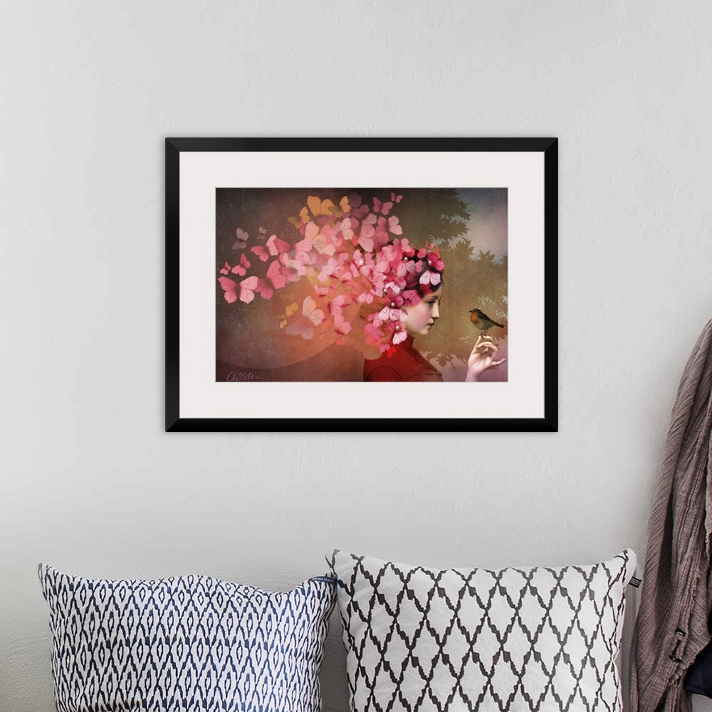 A bohemian room featuring A horizontal image of a lady with a bird.  A group of red and pink butterflies are fluttering fro...