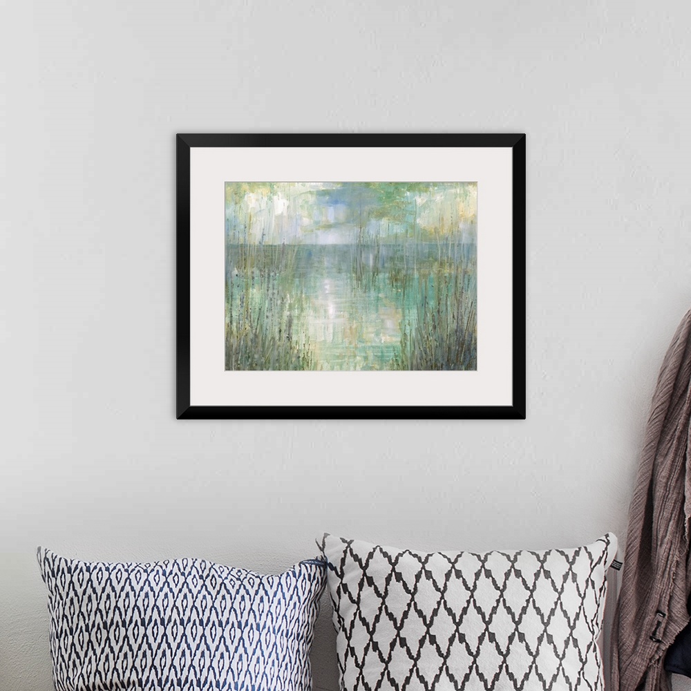 A bohemian room featuring Abstract landscape painting of the ocean behind tall beach grass in pale green, blue, purple, and...