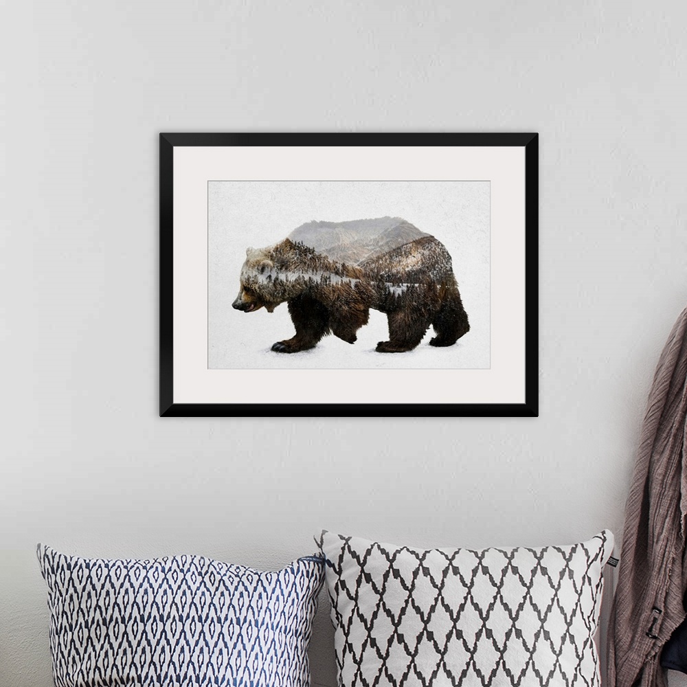 A bohemian room featuring A contemporary piece of artwork of a wilderness scene withing the outline of a brown bear.