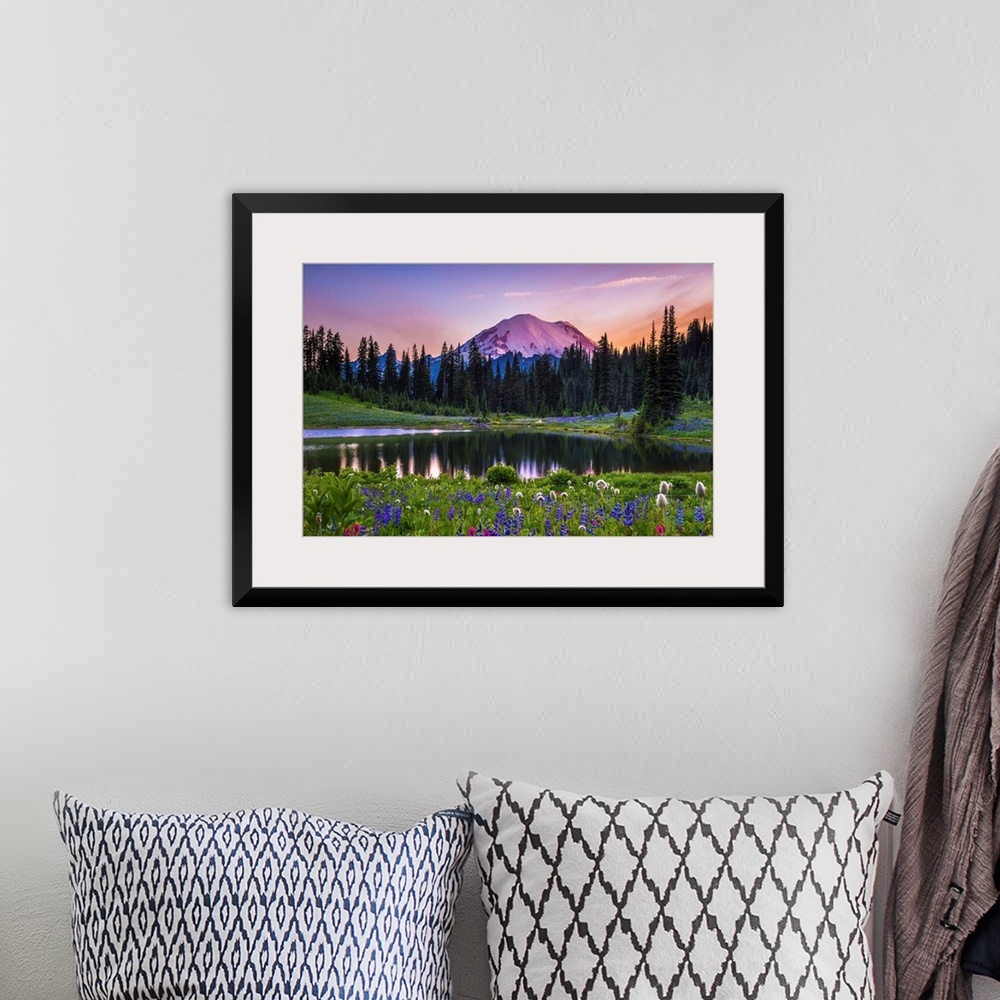 A bohemian room featuring Flowers along the edge of a lake with Mount Rainier in the distance, at sunset.