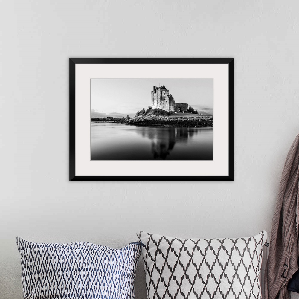 A bohemian room featuring Black and White landscape photograph of the Dunguaire Castle reflecting into the water on the sou...