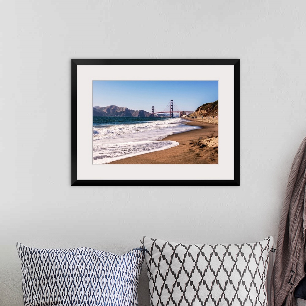 A bohemian room featuring Landscape photograph of a view of the Golden Gate Bridge from the pacific coast.