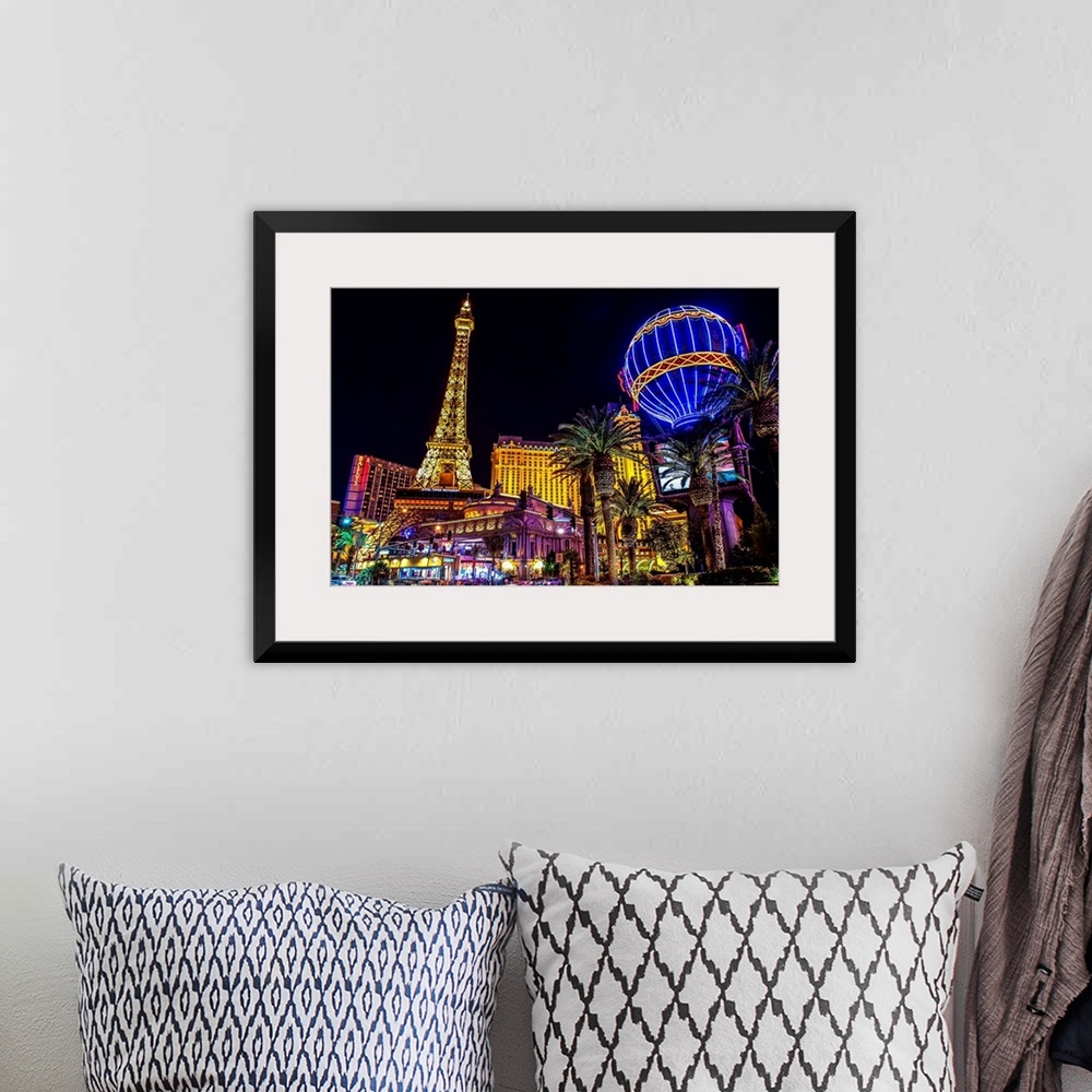 A bohemian room featuring Evening photograph of the Las Vegas strip with the Eiffel Tower and hot air balloon.