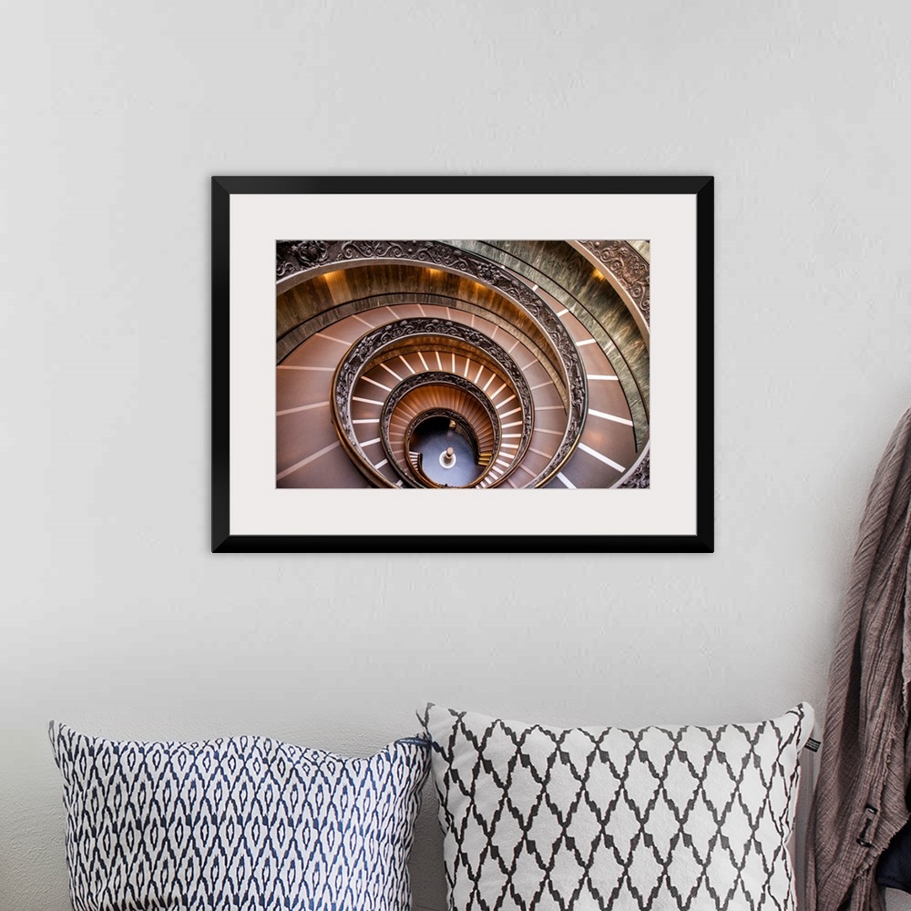 A bohemian room featuring Photograph of the spiral staircase at the Vatican Historical Museum.