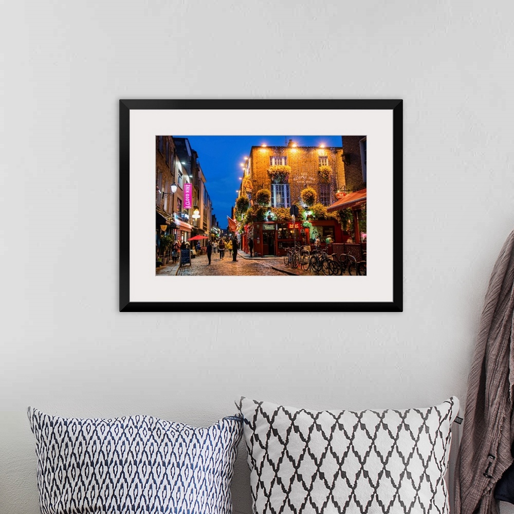 A bohemian room featuring Photograph of Temple Bar, a busy riverside neighborhood in Dublin, Ireland, at night.