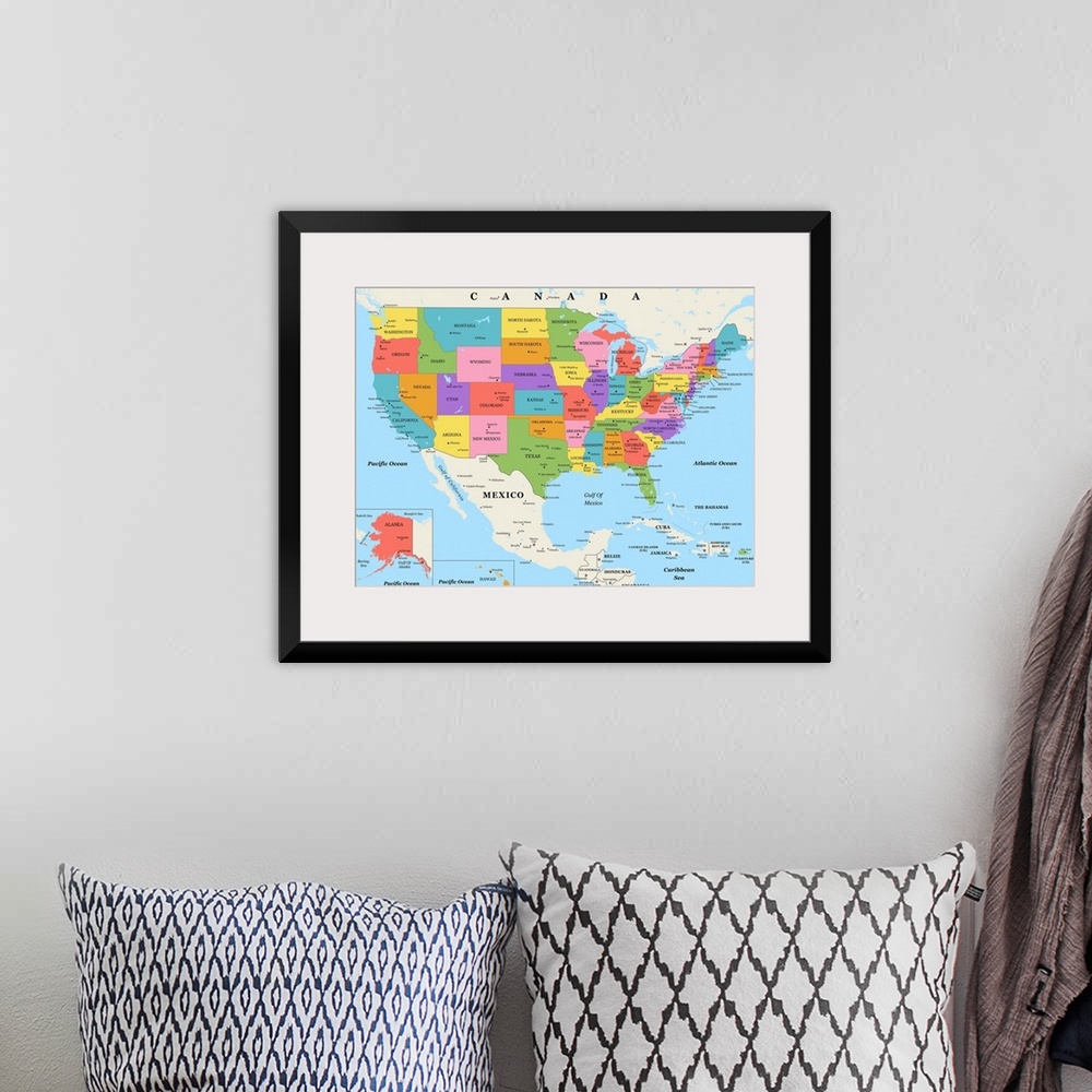 A bohemian room featuring Large color map of the United States of America with a classic font.