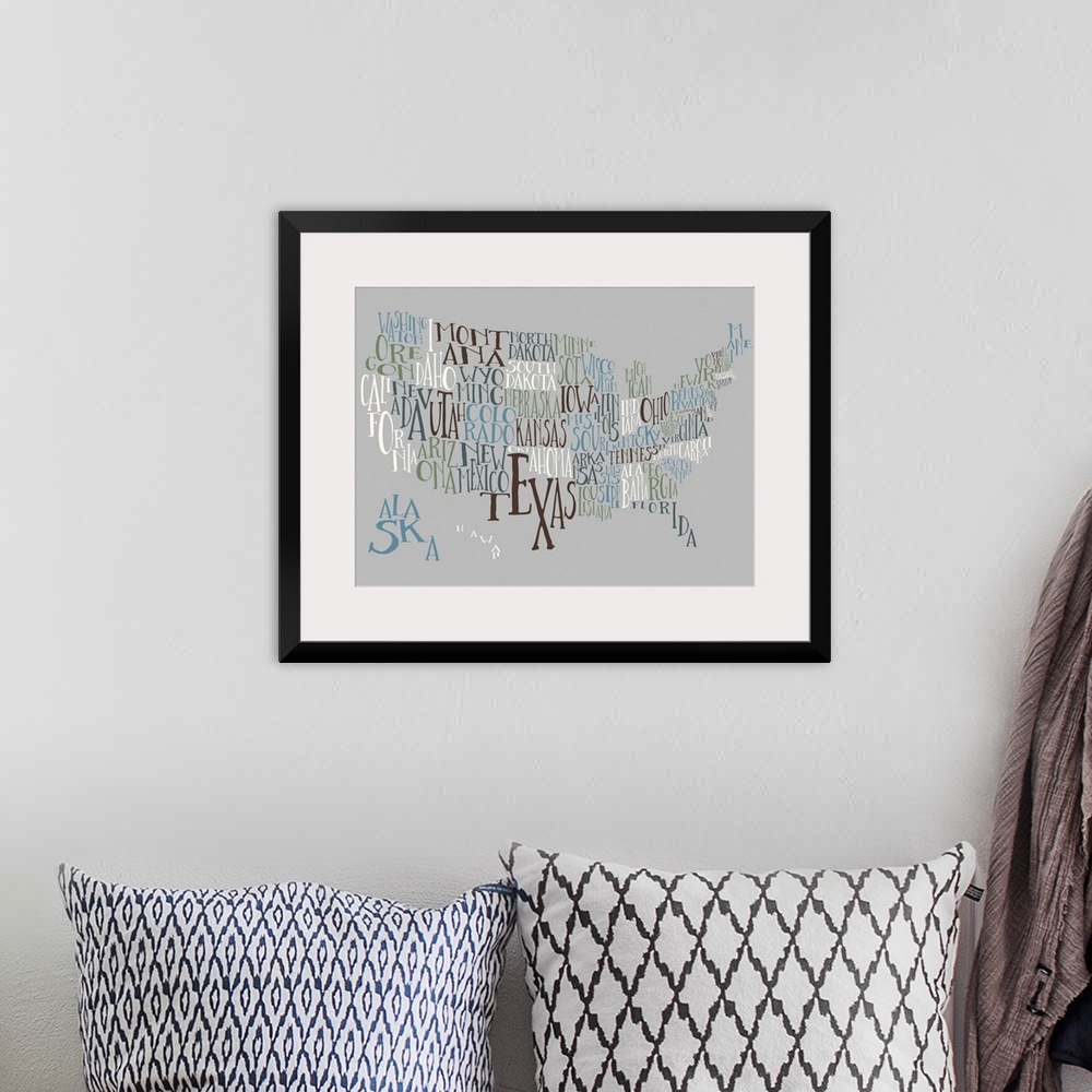 A bohemian room featuring A hand-drawn typography map of the United States with all the state names, in white, blue, and bl...