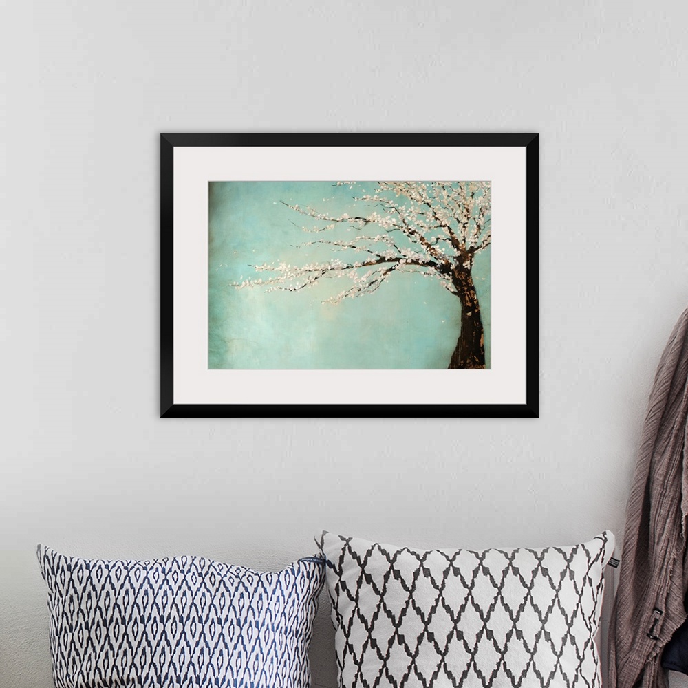 A bohemian room featuring Painting of a tree full of blooming flowers swaying in the wind against a cool background.