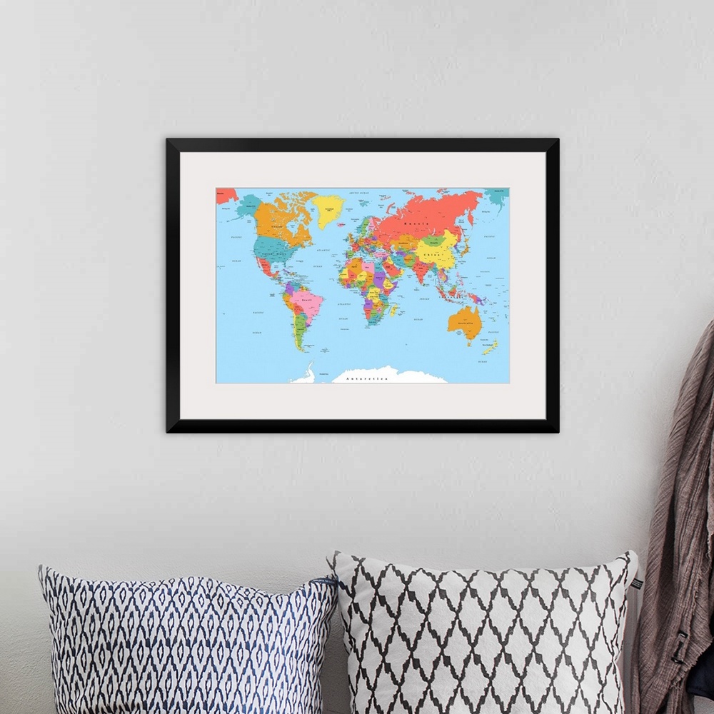 A bohemian room featuring Large color map of the World with a classic font.