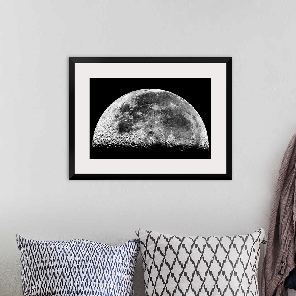 A bohemian room featuring Horizontal photograph of the Earthos moon displaying geographic features and craters.