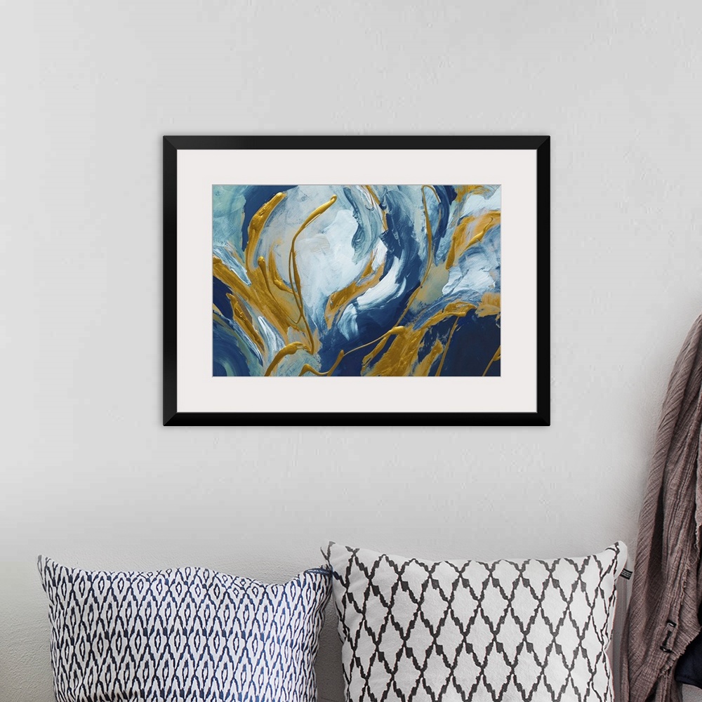 A bohemian room featuring Abstract artwork in blue and white with golden swirls.