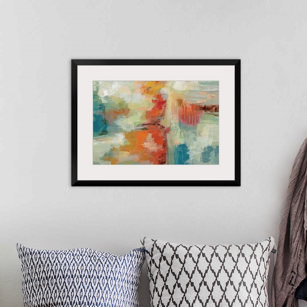 A bohemian room featuring Contemporary abstract artwork in bright oranges and blues.
