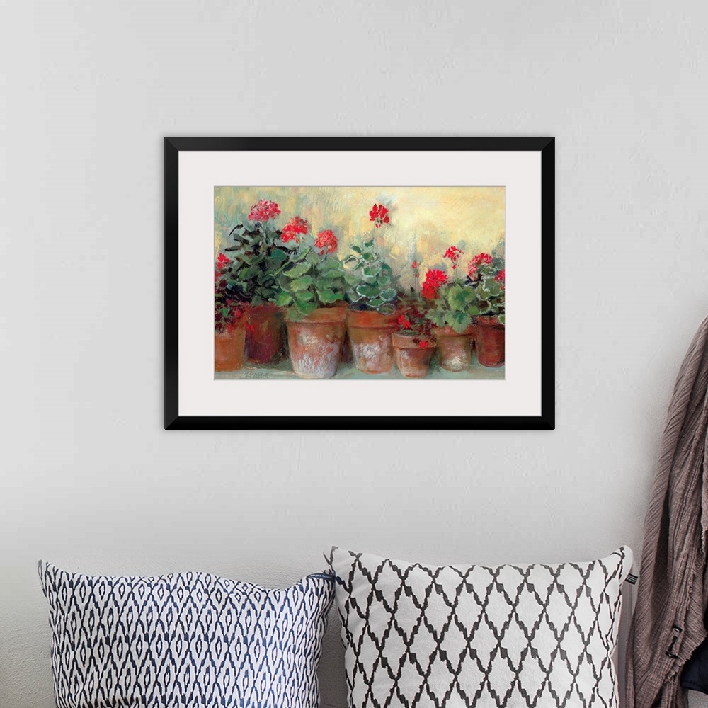A bohemian room featuring Painting of a row of flower pots varying in size.  Each flower pot contains bold colored flowers ...